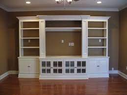 A wall unit entertainment center can put all your digital items in one area. Built In Entertainment Center Using Ikea Hemne Pieces 2 Bookcases 2 Glass Door Built In Entertainment Center White Entertainment Center Entertainment Center