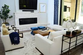 A masculine studio apartment can easily be brought to life with an accent color in the form of a a couple of vases with flowers in your living room, bedroom and bathroom can make a place feel. Before After A Sophisticated Masculine Living Room Heather Scott Home Design