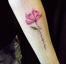 The style of the flower itself gives way to stunning watercolor flower tattoos, beautiful soft petals in marvelous shades of pink and peach. Great Inspiration 15 Flower Tattoo With Name In Stem