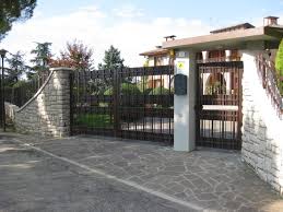 Modern spanish style garage door and motorized driveway gate in l.a. Driveway Gates Finelli Ironworks