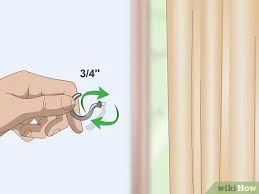 Use curtain tiebacks with the posts mounted at one quarter distance from the top of the window to create a theatrical effect. How To Tie Curtains 10 Steps With Pictures Wikihow