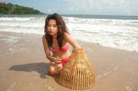 These fishing basket are affordable and available for online consumers. Pretty Asian Woman With Coop Like Trap For Catching Fish In Shallow Stock Photo Picture And Royalty Free Image Image 17232416