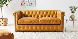 Leather sofas are a timeless piece of furniture that can stand up to wear and tear. Leather Dulcimer Petite Chesterfield Sofa Anthropologie
