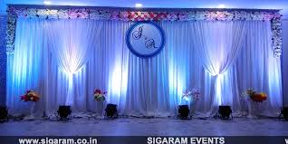 Our creative team works all the time to create new trends in reception backdrops for your wedding, be it floral walls or trending backdrops with props or a mix of all with lights to boot. Wedding Reception Stage Decoration At Hmk Mahal Villupuram