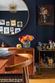 We believe that a midcentury dining room just isn't complete without a showstopping light fixture. Gold Is A Neutral