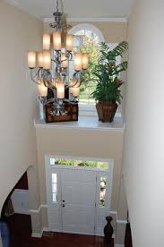Two Story Foyer With Shelf Above Door With Window What Idiot Came Up With This Design Z Ledge Decor Foyer Decorating Above Door Decor