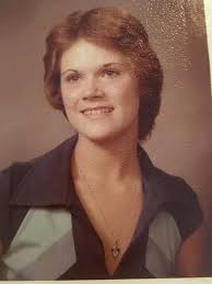 Monica and Paul Ferro about 50 years apart in front of Hedge school