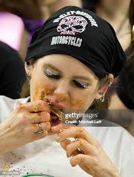 Molly Schuyler eats wings during Wing Bowl 23
