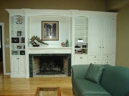 The mantel of your fireplace can serve as a nice place to display family photos or to hang stockings. Uneven Built In Design Ideas Pictures Remodel And Decor Living Room Built Ins Fireplace Surrounds Traditional Family Rooms