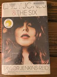 I just finished reading Daisy Jones & The Six. I enjoyed the oral  history-style format. The author even wrote all the lyrics to the songs.  I'm looking forward to the Netflix series