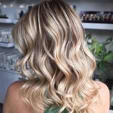 Give honey blonde hair with caramel swirls a whirl! The 16 Blonde Hair With Lowlight Looks To Try This Year Hair Com By L Oreal