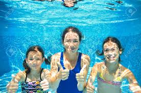 Family Swim In Pool Underwater Happy Active Mother And Children Family Swimming Swim Lessons Mother And Child