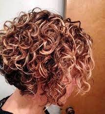 Long, shaggy tendrils parted in the center are a great way to rock your natural, wavy hair. 18 Short Stacked Spiral Perms Ideas Curly Hair Styles Curly Hair Styles Naturally Short Curly Hair