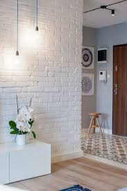 This wooden accent wall from champagne.chaos is a great idea if your living room lacks a standard fireplace or mantle. Pinterest Create An Elegant Statement With A White Brick Wall Mandalas F5e68f7d Resumesample Resume Brick Wall Living Room Brick Interior Wall Brick Interior