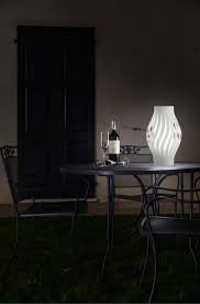 An elegant woven rattan texture gives this lamp a modern twist, while its dark curved body is beautifully complemented by a paneled cream shade. Helios Outdoor Table Lamp Ip67 In White Polilux Modern Design By Linea Zero Linea Zero Helios Out Bat D40 Modern Lamps To Decorate The Garden