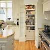 The corner style pantry helps to cleverly hide things not used daily and provides the kitchen with an uncluttered look. 1