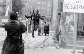 August 15, 1961. Just two days after construction on the Berlin Wall began,  a 19-year-old East German soldier named Konrad Schumann stood guard at a barbed  wire barrier on Bernauer Strasse. His