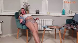 Foxy Removes Skirt Showing Long Legs and Soles in Pantyhose and Panties