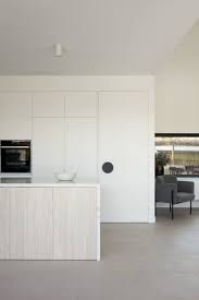 Design ideas for a large country kitchen/diner in london with a belfast sink, beaded cabinets, white cabinets, beige splashback, ceramic splashback, ceramic flooring and an island. Best 60 Modern Kitchen White Cabinets Ceramic Tile Floors Design Dwell