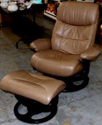 Bonded leather chair cover (can be removed for cleaning) on metal frame with hardwood legs and base. Sold Price Mid Century Modern Leather Recliner Chair With Matching Footstool Invalid Date Pdt