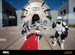 Actors Costumed As Stormtroopers From The Futuristic Science Fiction Movie Star Wars Accompany A Costumed Boy From The Futuristic Oakley Headquarters In Foothill Ranch Ca Stock Photo Alamy