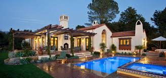 It has four bedrooms, three bathrooms, two studies, plus a pool out the back. New Spanish Colonial Revival Allen Construction House Plans 165496