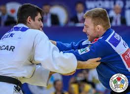 Its most prominent feature is its competitive element, where the objective is to either throw or takedown an opponent to the ground, immobilize or otherwise subdue an opponent with a pin, or force an opponent to submit with a joint lock or a choke. Eduard Trippel Ijf Org