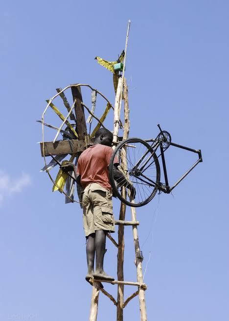 The Boy Who Harnessed the Wind — William Kamkwamba works on a homemade windmill constructed from salvaged materials and a bicycle.