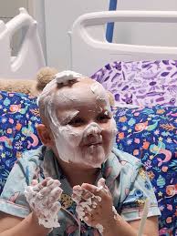 Child plays with shaving cream