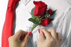 Starting from the top of the stems, begin to wrap floral tape down the stems in a spiral to secure. How To Put On A Boutonniere In 5 Easy Steps Ftd Com