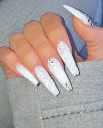 Look out for our new (old) line up in 2019! Extra Long White Coffin Nails With Glitter And Rhinestones Nailideas Sarahnails Nailarts White Coffin Nails Coffin Nails Glitter White Acrylic Nails