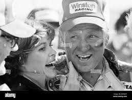 Stock Car driver Cale Yarborough and his wife Betty Jo rejoice in victory  lane of the Alabama International Speedway