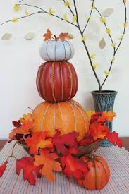 Many faux pumpkins come with a hole already on their underside, but if the pumpkins you are using do not have holes on the bottom, carve one stack the pumpkins in your urn or pot, arranging them in a way you find pleasing. How To Make A Stacked Pumpkin Decoration For Fall Holidappy
