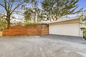 The redwood slats were alternated in two layers: Midcentury With Iconic Butterfly Roof In Beachwood Is Up For Grabs