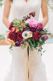 Red pink purple wedding bouquets. A Vibrant Spring Wedding Filled With Colourful Blooms Wedluxe Magazine Red Wedding Flowers Wedding Wedding Bridal Bouquets