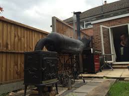 My Diy Smoker In Action Made From Wood Burning Stove And Gas Cylinder Smoker Plans Backyard Getaway Wood Stove