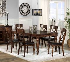 A glamorous dining room set up with an elegant red rug covering the tiles flooring. Dining Room Wild Country Fine Arts