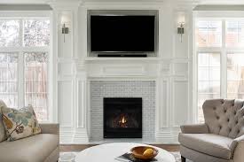 A wooden mantle shelf from vintage woodworks complements any wall as a beautiful display area. Gray Mini Subway Tiles On White Wooden Fireplace Mantel Transitional Living Room