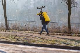 Discover prices, catalogues and new features. Early In The Morning A Young Man With A Backpack Carries A Large Office Chair Over His Head Bright Yellow Armchair In Winter Fog Street Of A Big City Kyiv Rusanivka