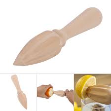 A plastic reamer sits atop a little plastic measuring cup. Cergrey 1pcs Useful Wooden Fruit Orange Lemon Juicer Squeezer Reamer Home Restaurant Kitchen Use New Lemon Reamer Wooden Lemon Juicer Walmart Canada