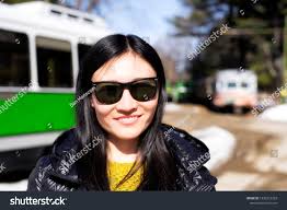 Chinese Woman Wearing Sunglasses Outside Seashore Stock Photo 1320515333