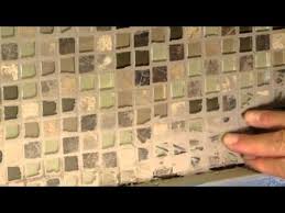 This might include any grout along shelves, corners and floor tiles, or the grout and tile that surrounds the shower drain. How To Remove Dried Grout Or Mortar From Tile Youtube