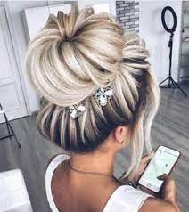 Then the ponytail is put through the donut and the hair is wrapped around it. Sock Bun Hairstyles How To Do A Sock Bun Hairstyles New Hair Styles Bun Hairstyles Sock Bun Hairstyles