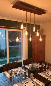 A rustic style dining room should feel a little handmade — and this diyed stay awhile sign by joyful derivatives blogger rachel joy is just the thing to a crystal chandelier. Custom Lighting Wood Chandelier Industrial Pendant Chandelier Etsy In 2021 Dining Chandelier Rustic Dining Chandelier Rustic Chandelier