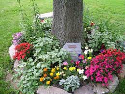 As We Approach Memorial Day We Reflect On Those We Ve Lost And One Way To Keep Those Memories Ali Landscaping Around Trees Garden Around Tree Memorial Garden