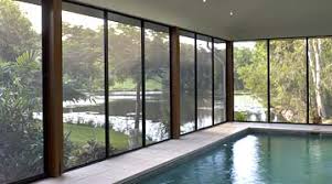 A folding room divider and privacy screen that conveniently balances fashion and function. Pool Patio Enclosures Australia Invisi Gard
