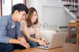 Dreamstime is the world`s largest stock photography community. Asian Young Couple Using Laptop Computer Think And Searching Internet Stock Photo Crushpixel