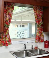 One of the most effective window treatment ideas for over the kitchen sink window is to install shades such as wood blinds. How To Make Kitchen Towel Curtain Tiers Petticoat Junktion