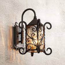 An outdoor wall sconce can be: Casa Seville 13 1 4 High Iron Scroll Outdoor Wall Light 72058 Lamps Plus