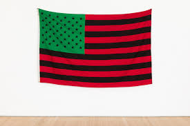 The men and women of american military services who have served their country over seas wear a black and white american flag (which also show american struggle) most typically on their right. The Broad Acquires David Hammons African American Flag 50 Foot Long Mark Bradford Work Artnews Com